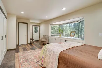 a bedroom with a large bed and a window at Private Lake Access Pet-Friendly Home in Arnold! in Arnold