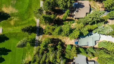 an overhead view of a yard with a house and trees at Wintergreen at Tahoe Donner by Tahoe Getaways - 3BR w HOA! in Truckee