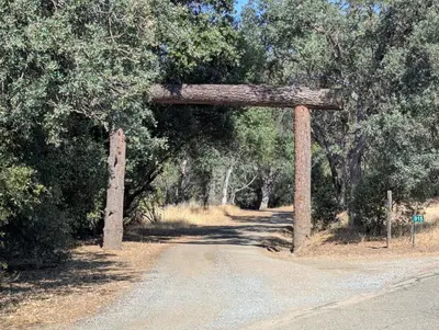 an arch in the middle of a dirt road at Sierra Escape RV in Squaw Valley