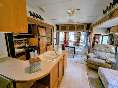 a kitchen and living room in a travel trailer at Sierra Escape RV in Squaw Valley