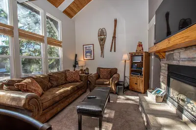 a living room with a couch and a fireplace at Dollar Hill II # 61 By Hauserman Rentals in Tahoe City