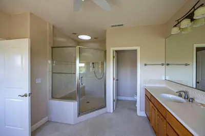 a bathroom with a shower and a sink at Hemlock Hacienda in Groveland