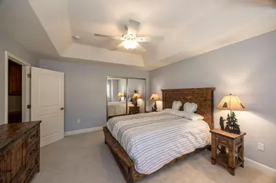 a bedroom with a bed and a ceiling fan at Hemlock Hacienda in Groveland