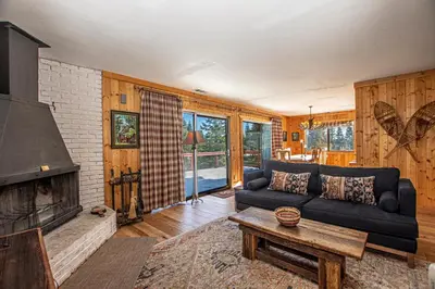 a living room with a couch and a fireplace at Goetzl By Hauserman Rentals in Tahoma