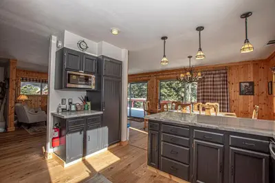 a kitchen with gray cabinets and a counter top at Goetzl By Hauserman Rentals in Tahoma