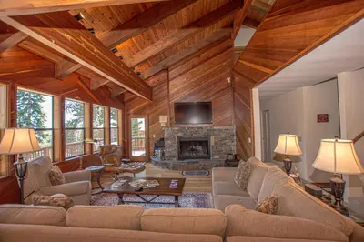 a living room with a couch and a fireplace at Big Pine By Hauserman Rentals in Tahoe City