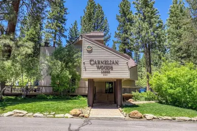 a building with a sign on the front of it at Carnelian Woods # 11 By Hauserman Rentals in Carnelian Bay