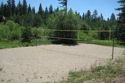 a volleyball court with a net in a field at Carnelian Woods #128 By Hauserman Rentals in Carnelian Bay