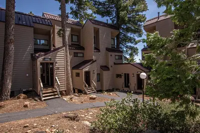 an exterior view of a building with trees at Carnelian Woods #128 By Hauserman Rentals in Carnelian Bay