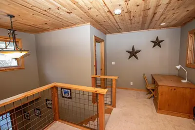 a room with a wooden ceiling with stars on the wall at Bonanza By Hauserman Rentals in Tahoe City