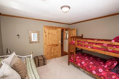 a bedroom with a bunk bed and a closet at Bonanza By Hauserman Rentals in Tahoe City