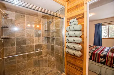 a bathroom with a shower and a glass shower stall at Carnelian Bay Hideaway By Hauserman Rentals in Carnelian Bay