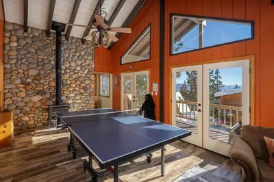 a ping pong table in the middle of a room at Catalpa Vista By Hauserman Rentals in Tahoe Vista