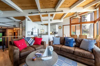 a living room with two couches and a table at Star Harbor # 10 By Hauserman Rentals in Tahoe City