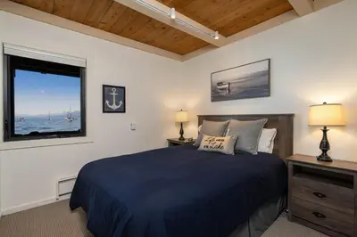 a bedroom with a large bed and a window at Star Harbor # 10 By Hauserman Rentals in Tahoe City