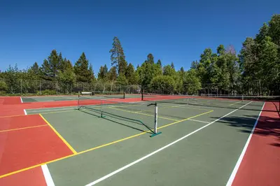 a tennis court with two tennis nets on it at Star Harbor # 10 By Hauserman Rentals in Tahoe City