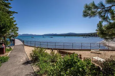 a view of a beach with boats in the water at Star Harbor # 10 By Hauserman Rentals in Tahoe City