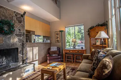 a living room with a couch and a fireplace at Dollar Hill II # 49 By Hauserman Rentals in Tahoe City