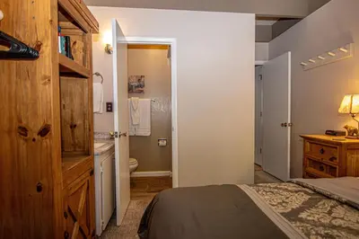 a bedroom with a bed and a bathroom at Dollar Hill II # 49 By Hauserman Rentals in Tahoe City