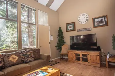 a living room with a couch and a television at Dollar Hill II # 49 By Hauserman Rentals in Tahoe City