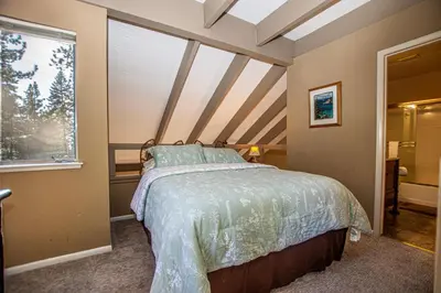 a bedroom with a bed and a window at Dollar Hill II # 49 By Hauserman Rentals in Tahoe City