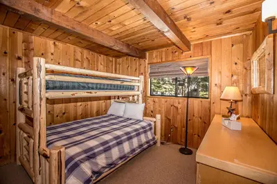 a bedroom with a bunk bed in a cabin at Edelweiss Escape By Hauserman Rentals in Tahoe City