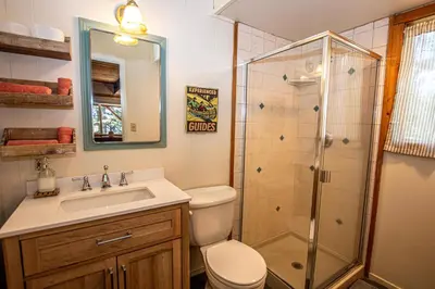 a bathroom with a shower and a toilet and a sink at Alpine Welcome By Hauserman Rentals in Tahoe City