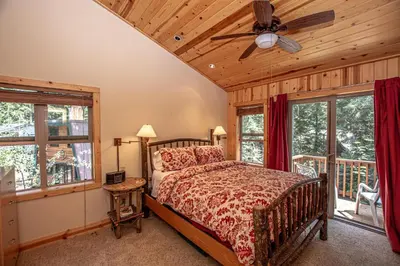 a bedroom with a bed and a ceiling fan at Tahoe Woods By Hauserman Rentals in Tahoe City