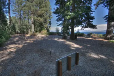 a park with a bench in the middle of a field at Tahoe Woods By Hauserman Rentals in Tahoe City