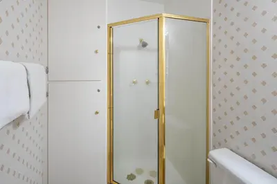a shower with a glass door in a bathroom at Dollar Point Lodge By Hauserman Rentals in Tahoe City