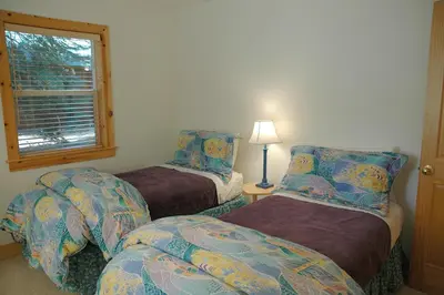 a room with two beds and a window at Going By Hauserman Rentals in Homewood