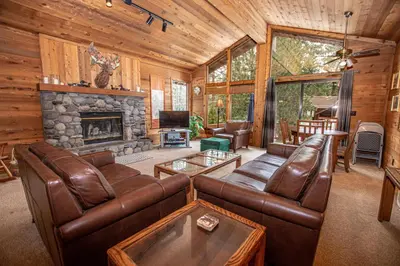 a living room with leather furniture and a fireplace at Vance By Hauserman Rentals in Tahoe City