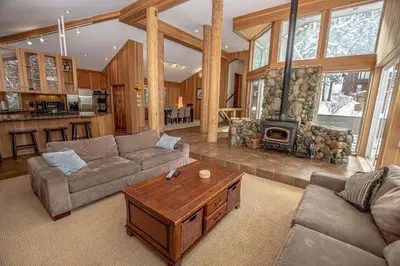 a living room with a couch and a fireplace at Snow Crest By Hauserman Rentals in Alpine Meadows