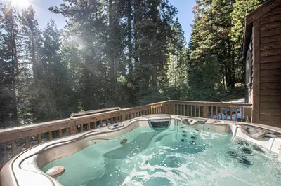 a jacuzzi tub on the back of a house at Black Bear Haus By Hauserman Rentals in Tahoe City