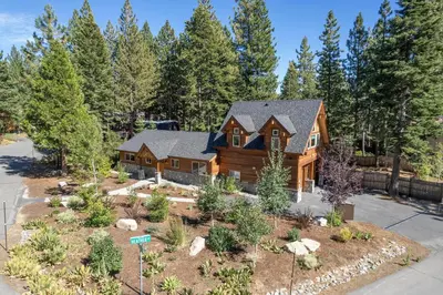 an image of a log home with a garden at Cedarwood Serenity By Hauserman Rentals in Tahoe City