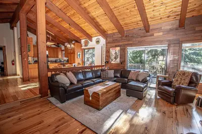 a living room with leather couches and a table at Home Swede Home By Hauserman Rentals in Tahoe City