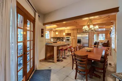 a kitchen and dining room with a table and chairs at Poplar Place By Hauserman Rentals in Homewood