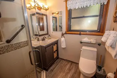 a bathroom with a toilet and a sink and a shower at Franciscan Lakeside # 29 By Hauserman Rentals in Tahoe Vista
