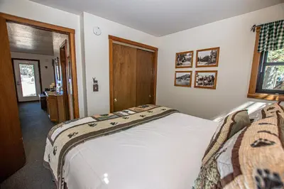 a bedroom with a large white bed in a room at Franciscan Lakeside # 29 By Hauserman Rentals in Tahoe Vista