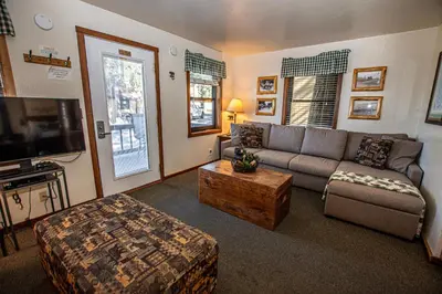 a living room with a couch and a coffee table at Franciscan Lakeside # 29 By Hauserman Rentals in Tahoe Vista