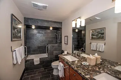 a bathroom with a sink and a toilet and a shower at Rygh Lakefront By Hauserman Rentals in Carnelian Bay