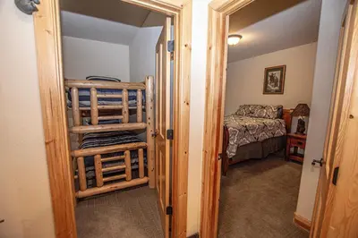 a bedroom with a bed and a room with a closet at Sherman By Hauserman Rentals in Tahoma