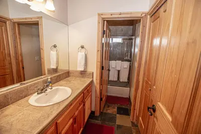 a bathroom with a sink and a shower at Sherman By Hauserman Rentals in Tahoma