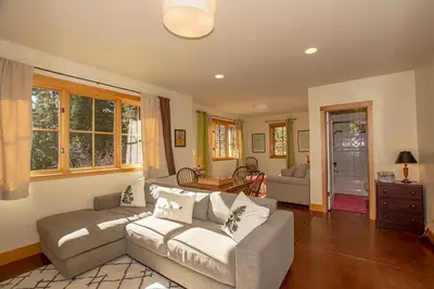 a living room with a couch and a table at Snowglobe By Hauserman Rentals in Tahoe City
