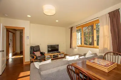 a living room with a couch and a table at Snowglobe By Hauserman Rentals in Tahoe City