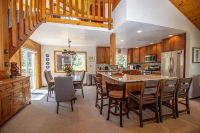 a kitchen with a large table and chairs in a room at Eagle Pines By Hauserman Rentals in Tahoe City