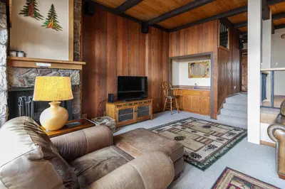 a living room with a couch and a television at Star Harbor # 4 By Hauserman Rentals in Tahoe City