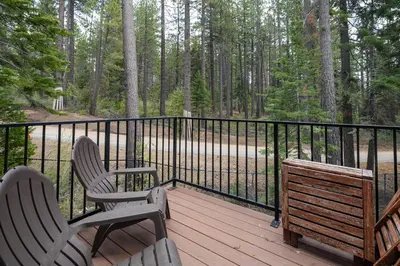 two chairs and a bench sitting on a wooden deck at St Francis #14 By Hauserman Rentals in Tahoe City
