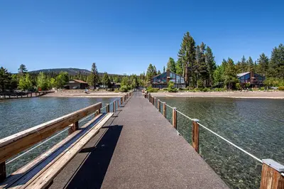 a bridge over a body of water with houses at St Francis #14 By Hauserman Rentals in Tahoe City