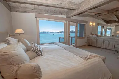 a large bedroom with a large bed with a large window at Star Harbor # 8 By Hauserman Rentals in Tahoe City